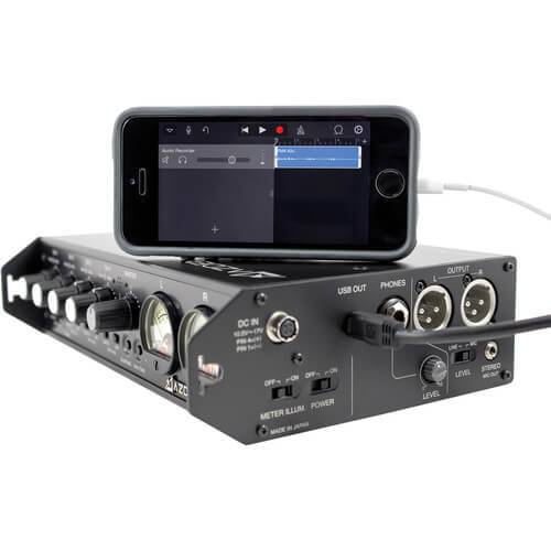 Azden FMX-42u 4-channel audio mixer with USB digital output, shown connected to a smartphone for portable audio recording. – image 4