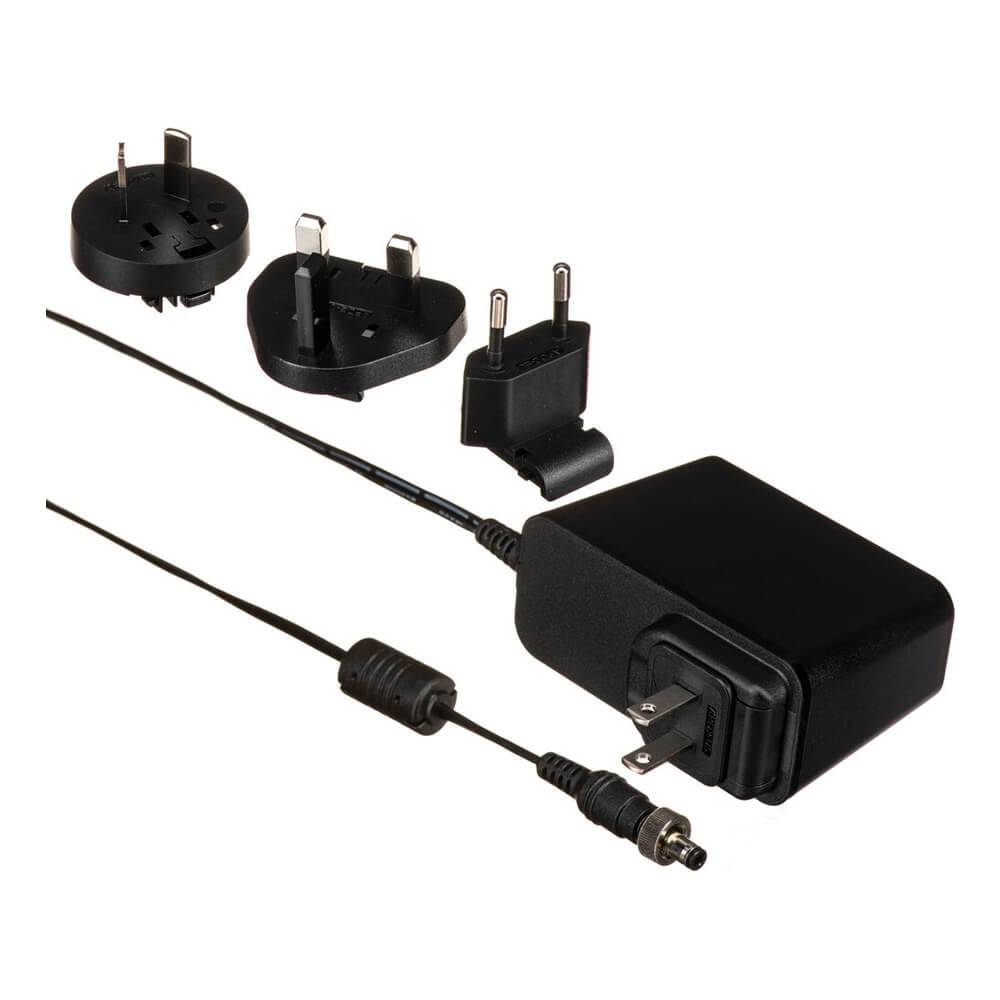 Blackmagic Design 12V60W power supply for ATEM Mini Extreme with locking connector, black plastic casing, and power cable attached. – image 1