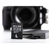 Angelbird 512GB AV Pro MK2 UHS-II SDXC memory card lying on a white surface, showcasing its storage capacity and compact design.