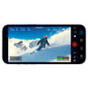 Blackmagic Camera ProDock Smartphone displaying a snowy landscape with a person skiing, showing camera interface on screen.