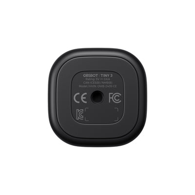 OBSBOT Tiny 3 AI-powered 4K PTZ webcam viewed from the bottom, showing adjustable mounting and lens details.