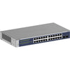 Front left view of Netgear GS724T 24-port Gigabit managed network switch showing ports and front panel features.