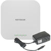 Netgear AX1800 dual-band wireless access point with 2.5 Gigabit Ethernet port, front view showing LED indicators and sleek design.