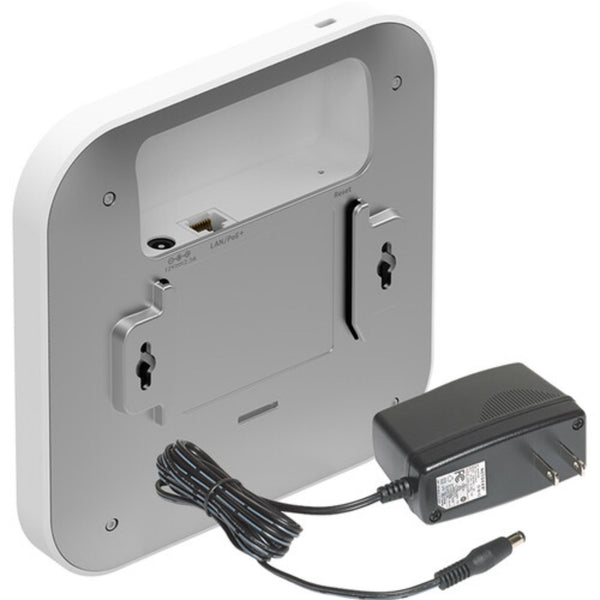 Rear left view of Netgear AX1800 wireless dual-band 2.5 Gigabit insight managed access point, showing ports and ventilation. – image 4
