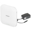 Netgear WAX620PA AX3600 dual-band wireless access point with 2.5 Gigabit Ethernet ports and power adapter, front right view.