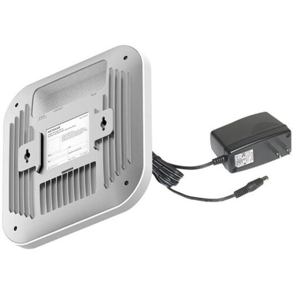 Rear right view of Netgear WAX620PA AX3600 wireless dual-band access point with power adapter, showing ports and design features. – image 4