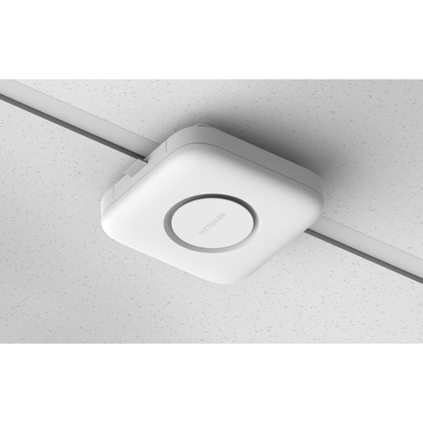 Netgear Cloud Managed WiFi 7 wireless access point installed on ceiling with antennas for enhanced network coverage. – image 9