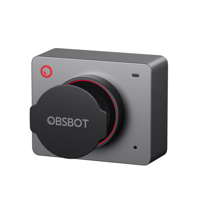 OBSBOT Meet 2 AI-powered 4K webcam in space grey with magnetic privacy cover, showing front view on a desk setup.