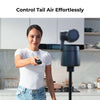 Woman holding a remote control with text 'Control Tail Air Effortlessly' in a kitchen setting.