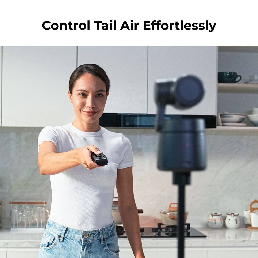 Woman holding a remote control with text 'Control Tail Air Effortlessly' in a kitchen setting. – image 5