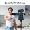 Woman holding a remote control with text 'Control Tail Air Effortlessly' in a kitchen setting.