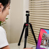 Desk-level setup using the OBSBOT Foldable Lightweight Tripod for video calls and streaming.