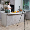 Close-up view highlighting the compact build and leg design of the tripod.