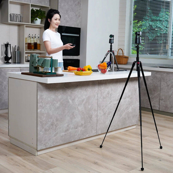Close-up view highlighting the compact build and leg design of the tripod. – image 8