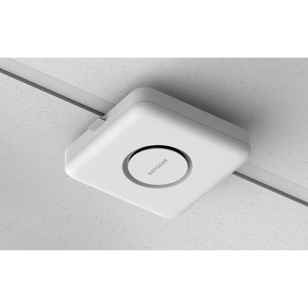 Netgear WBE758 Tri-Band WiFi 7 wireless access point mounted on a ceiling, showcasing its sleek design and connectivity features. – image 20