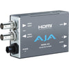 AJA Hi5 HD-SDI to HDMI video and audio converter device connected to a monitor, showing high-definition video output.