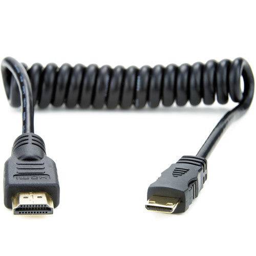 Atomos HDMI cable with full-sized to mini HDMI connector, coiled design, 11.8 to 17.7 inches, ideal for camera and device connections. – image 1