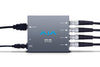 AJA Hi5-4K SDI to HDMI video converter with cables, compact device for converting SDI signals to HDMI output.
