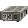 IDX System Technology IA-200a 100W AC adapter power supply for video cameras, shown from top view with cable connectors visible.