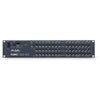 AJA KUMO 32x32 Compact SDI Video Router with power supply, rear view showing input and output ports.