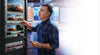 Blackmagic Design Smart Videohub 20 x 20 6G-SDI video router mounted in a rack with multiple SDI connection ports.