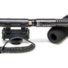 Azden SGM-990+i shotgun microphone for cameras and mobile devices, shown from the top view with microphone grille and brand logo.
