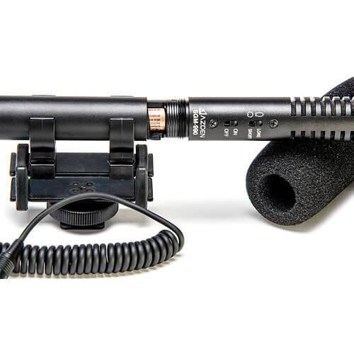 Azden SGM-990+i shotgun microphone for cameras and mobile devices, shown from the top view with microphone grille and brand logo. – image 2