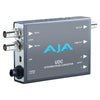 AJA UDC HD/SD/3G Up/Down/Cross Converter video capture device showing front panel with connectors and controls.
